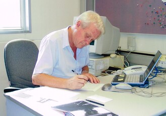 His love for drawing and publishing: Professor Morton reviewing a piece of important research writing ready for publishing.